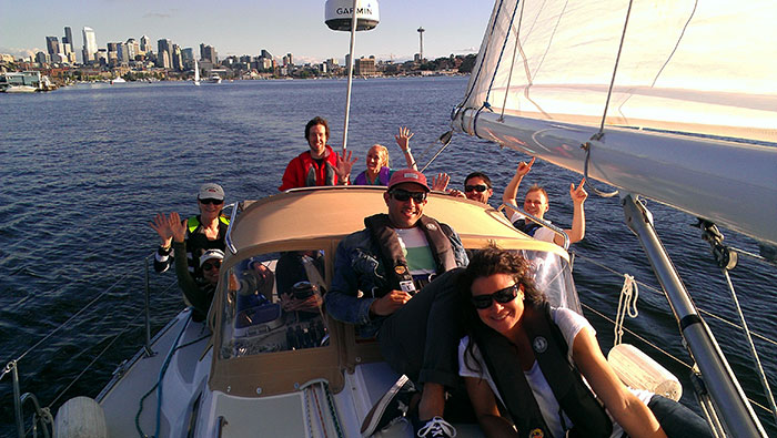 Smiling members on a sailboat - Member Program - Olympic Club Program - Flotilla