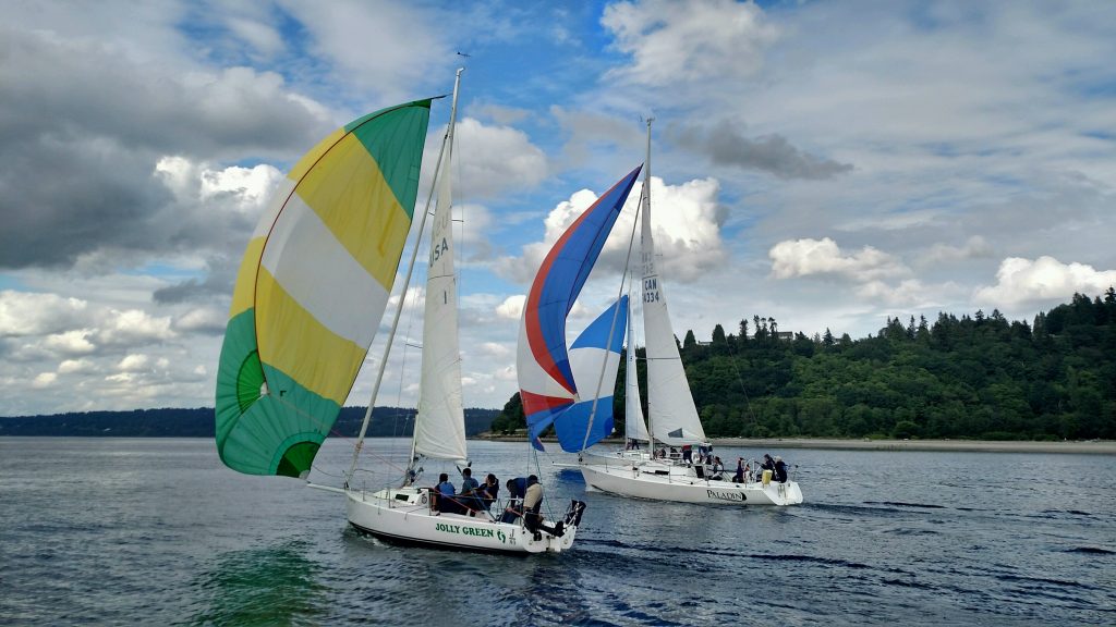 Sailboats with colorful sails: Professional Team Building Programs: Sailboats