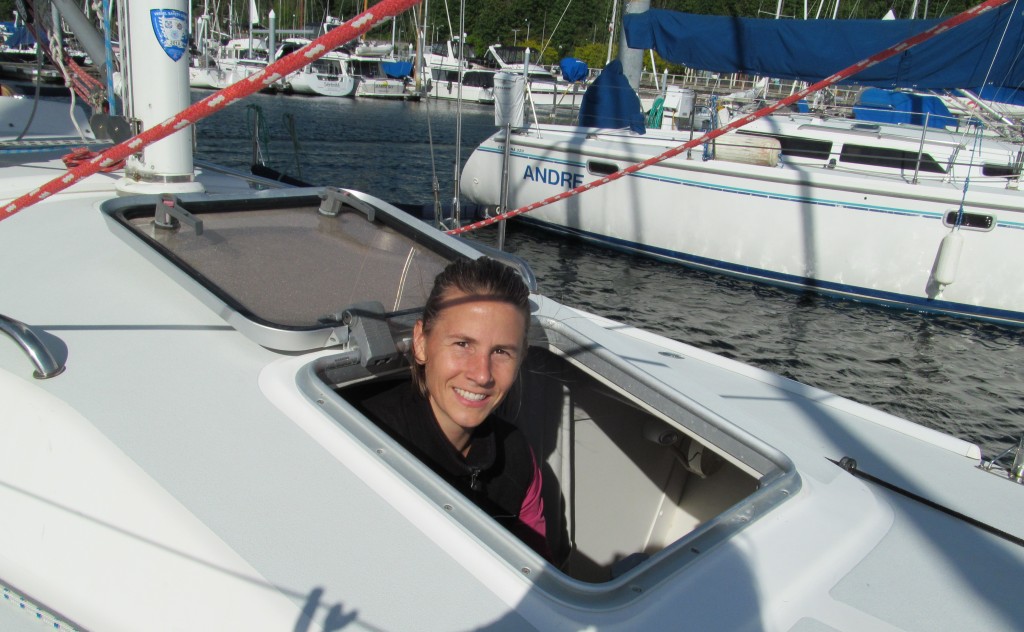 Woman peeking out of a sailboat