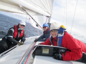 Smiling sailors on a sailboat